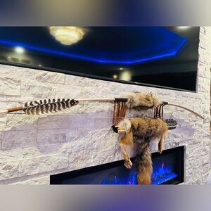 Hand made bow and arrow by enrolled member of the Cherokee tribe. 68”